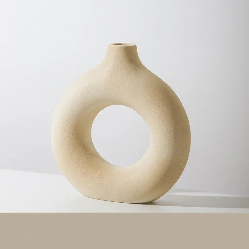 Unglazed porcelain biscuit vase with frosted particle surface in neutral colour