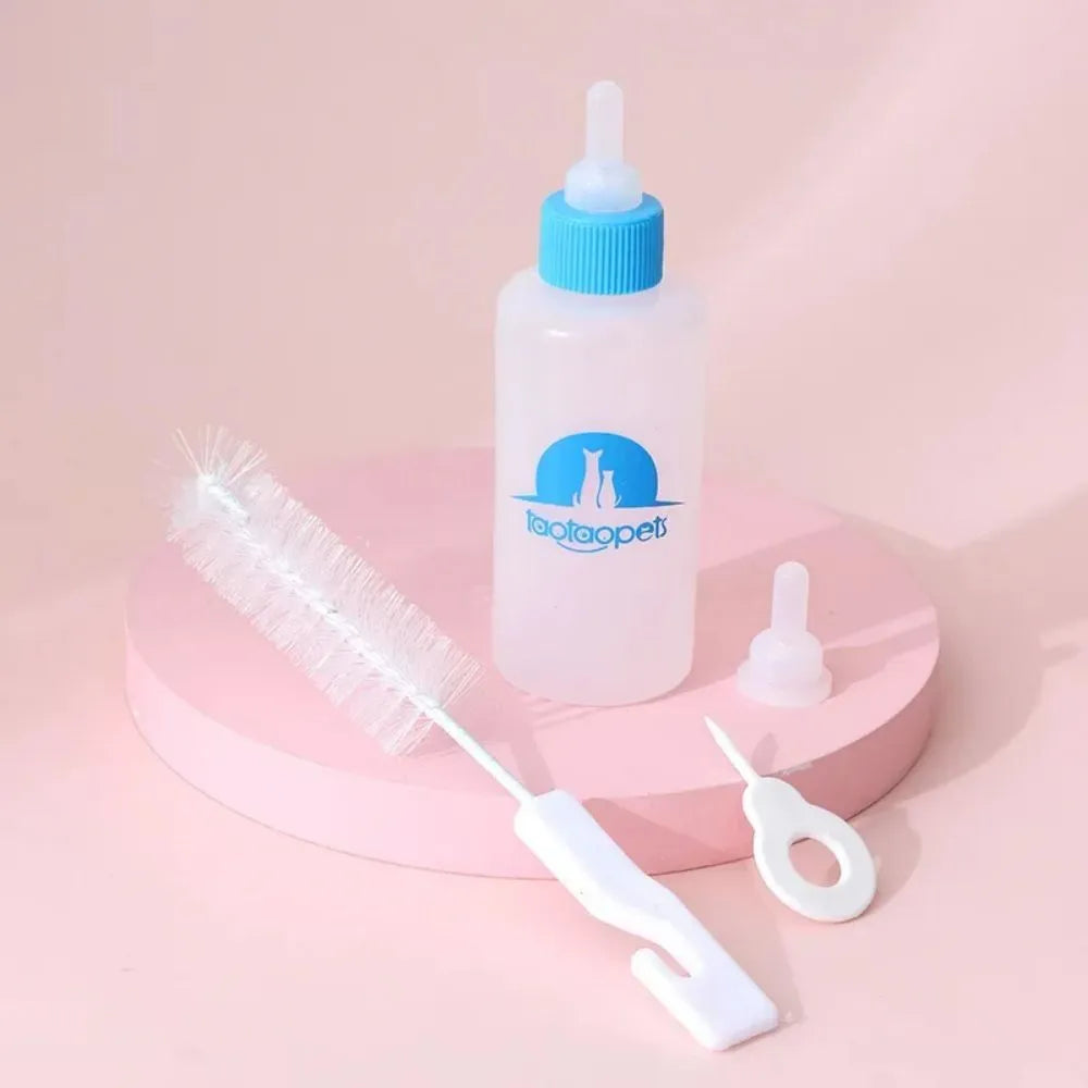 Set of four coloured pet milk bottles and a cleaning brush for feeding small animals
