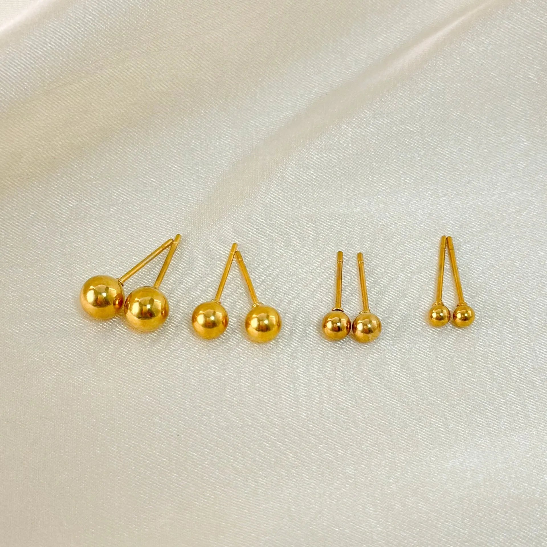 Stainless steel ball stud earrings in minimalist geometric design