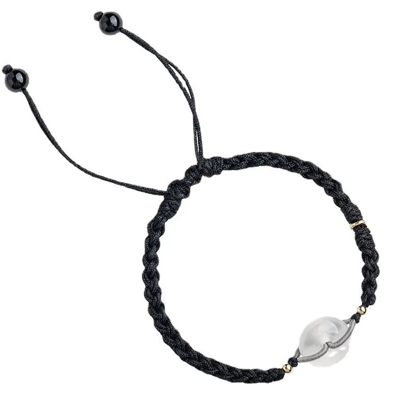 Crystal bracelet with woven rope strap and geometric square grain detailing in ethnic style