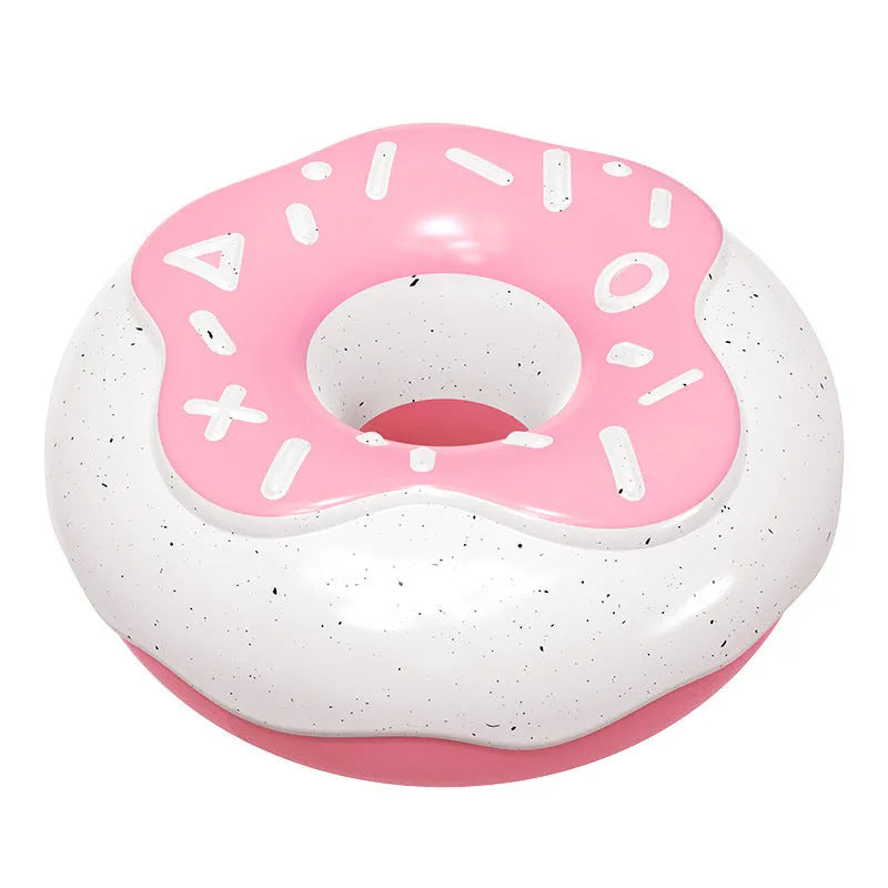 Pink TPR donut-shaped dog chew toy with raised dental cleaning nodules and squeaker inside