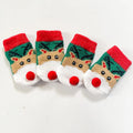 Set of four Christmas dog socks with Santa Claus and elk cartoon patterns in blue and red colours