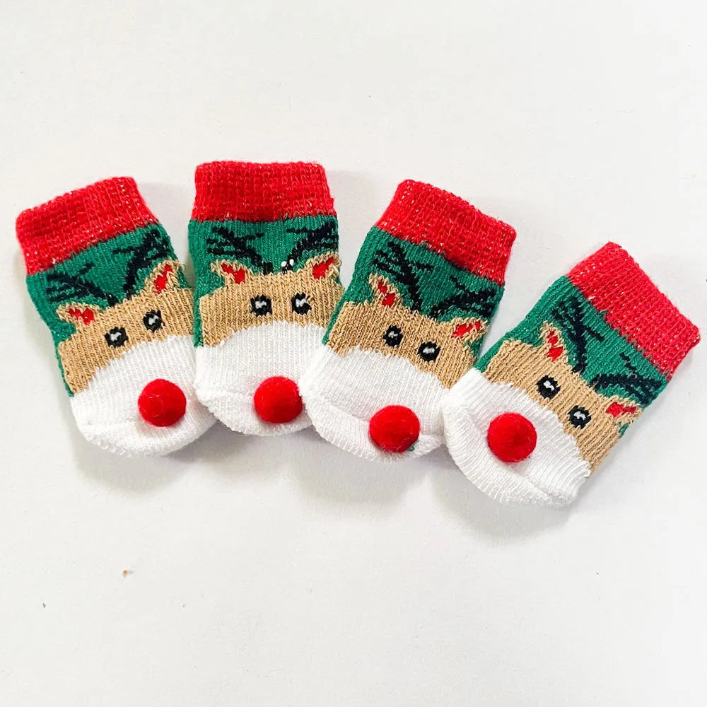 Set of four Christmas dog socks with Santa Claus and elk cartoon patterns in blue and red colours