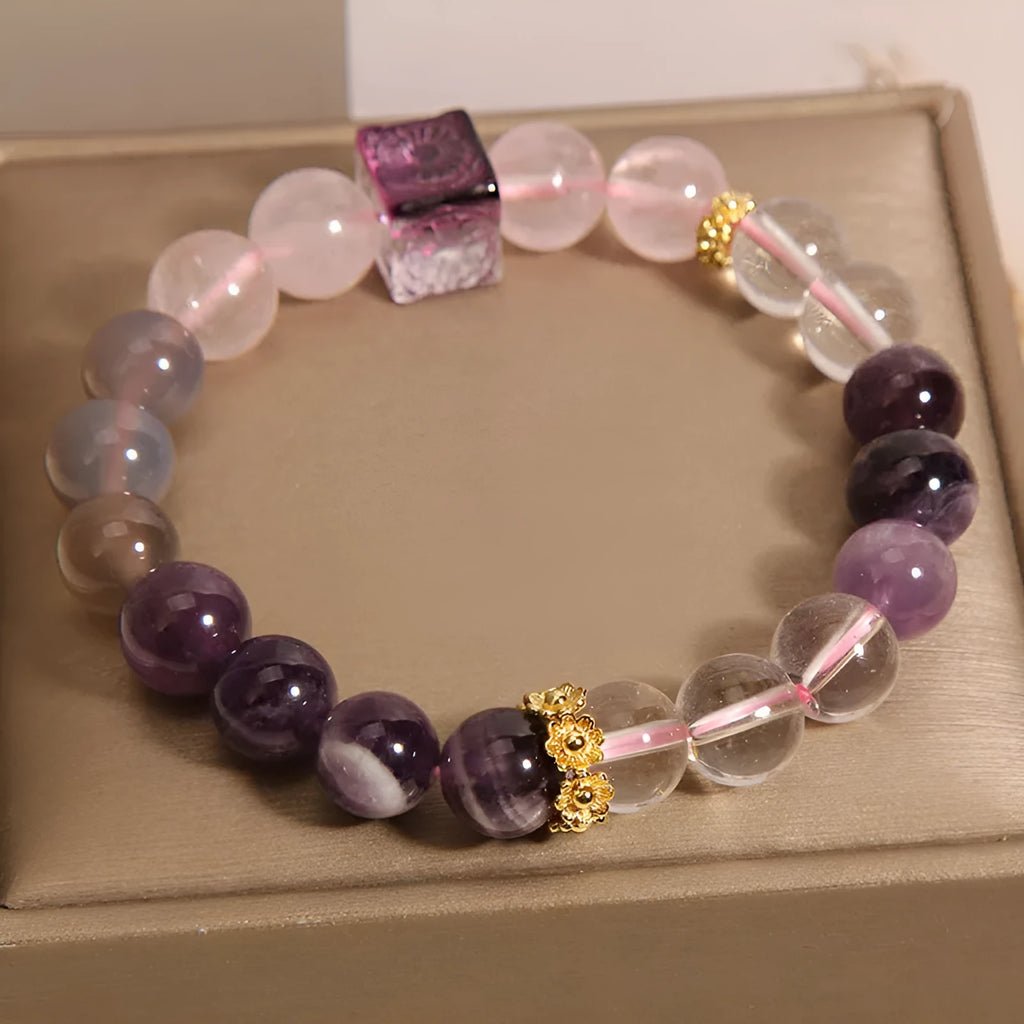 Women's purple amethyst crystal bracelet with rhinestone details measuring 10mm