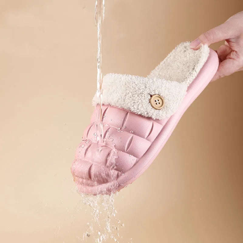 Plaid detachable slippers for women with plush lining and EVA sole in pink, shown on a wooden floor.