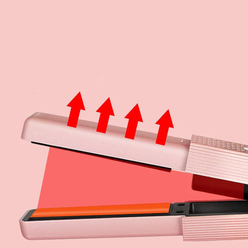 Pink and green mini cordless USB hair straightener with ceramic plates open on a white background.