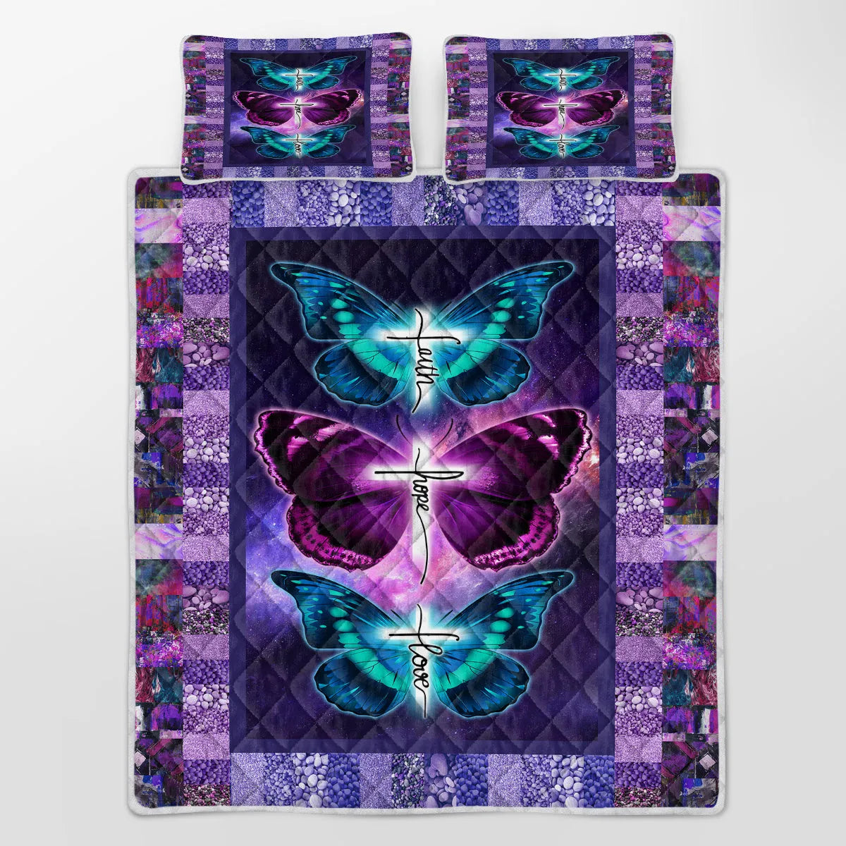 Purple 3-piece butterfly patterned quilt set with quilt and two pillow shams on a bed