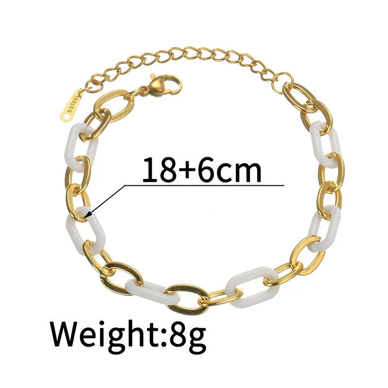 Stainless steel bracelet for women with a double-layered red resin heart charm on a metallic chain.