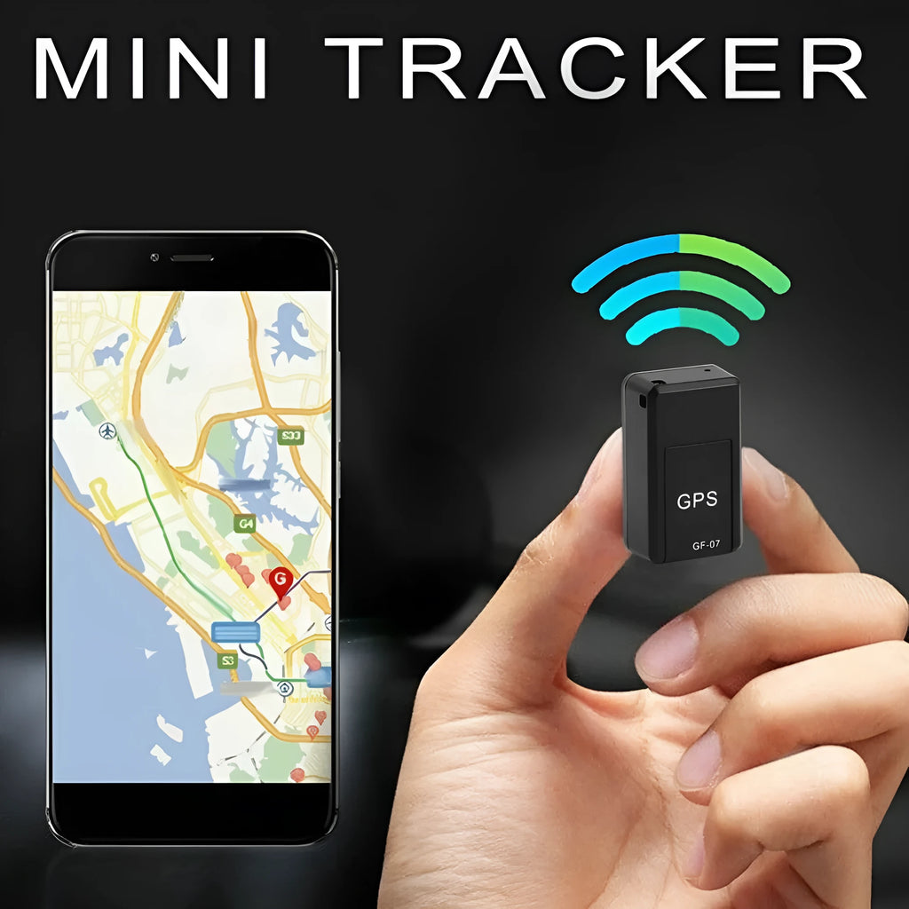Small black plastic magnetic GPS tracker device next to a USB charging cable.
