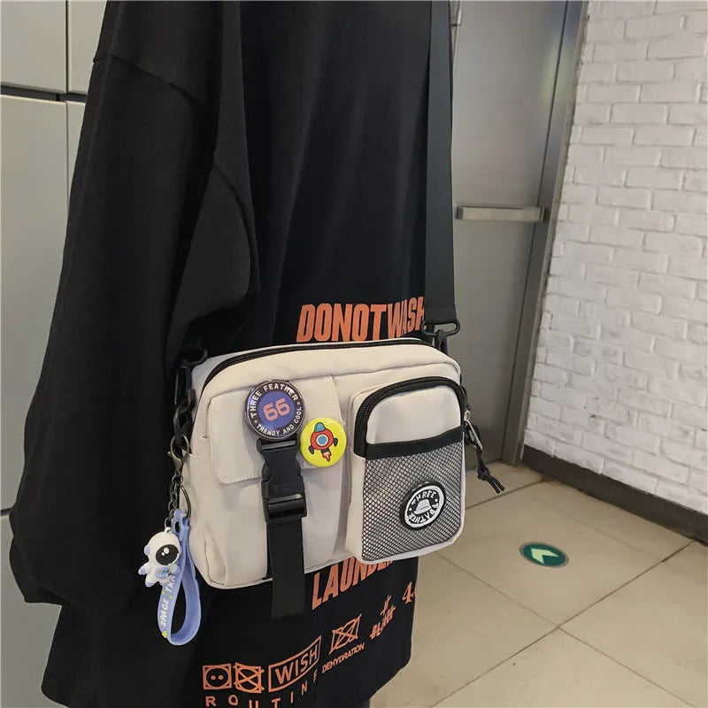 Casual nylon messenger bag for men women waterproof lightweight 22x6x17cm with badge pendants in beige black blue gray