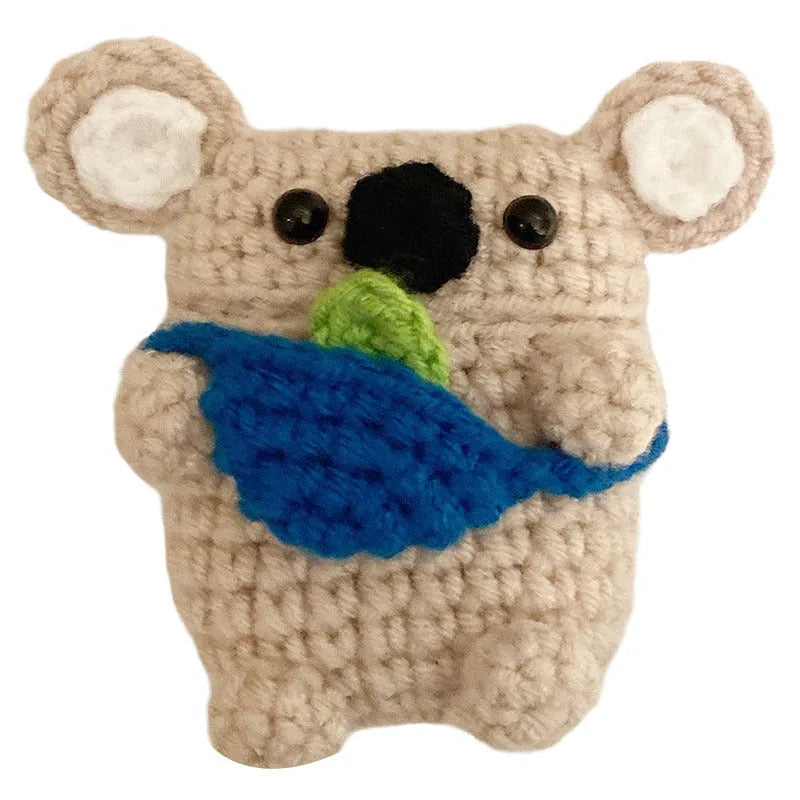 Hand knitted AirPods protective sleeve with koala bear backpack design on Apple AirPods case
