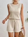 Women's apricot sleeveless vest and matching shorts set on hanger