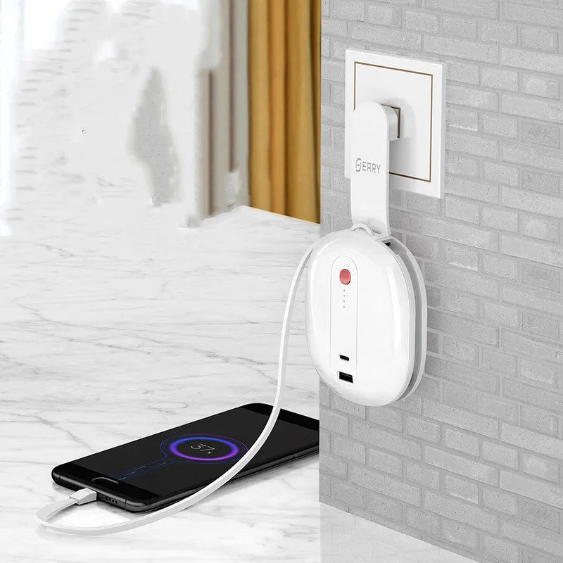 White portable power bank with folding UK plug showing 10000mAh capacity label