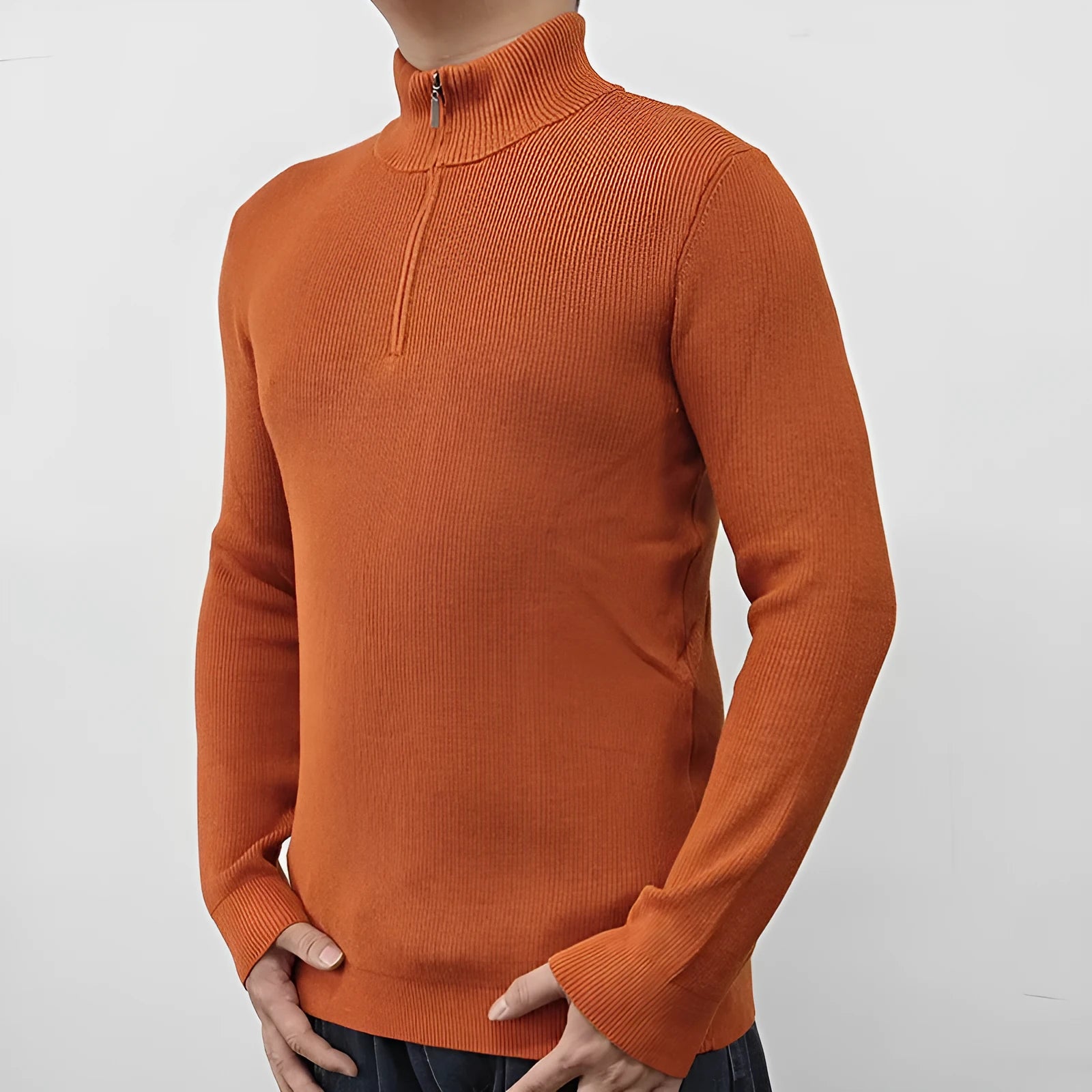 Man wearing a grey half turtleneck zip front sweater, a casual cotton blend pullover.