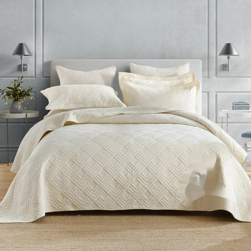 Pure cotton bed cover three-piece set shown in a light colour on a bed, featuring a quilt cover and sheet.