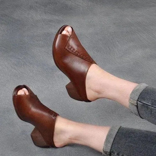 Women's black square heel peep-toe slippers showing fish mouth scaffold design and rubber sole