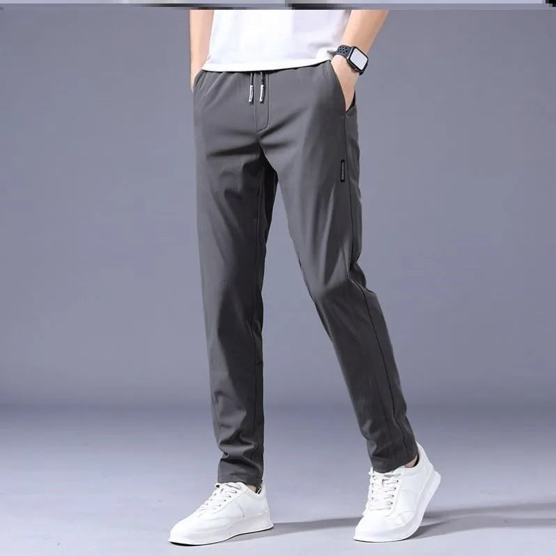 Men's drawstring trousers Korean version loose straight leg sweatpants in khaki colour on model