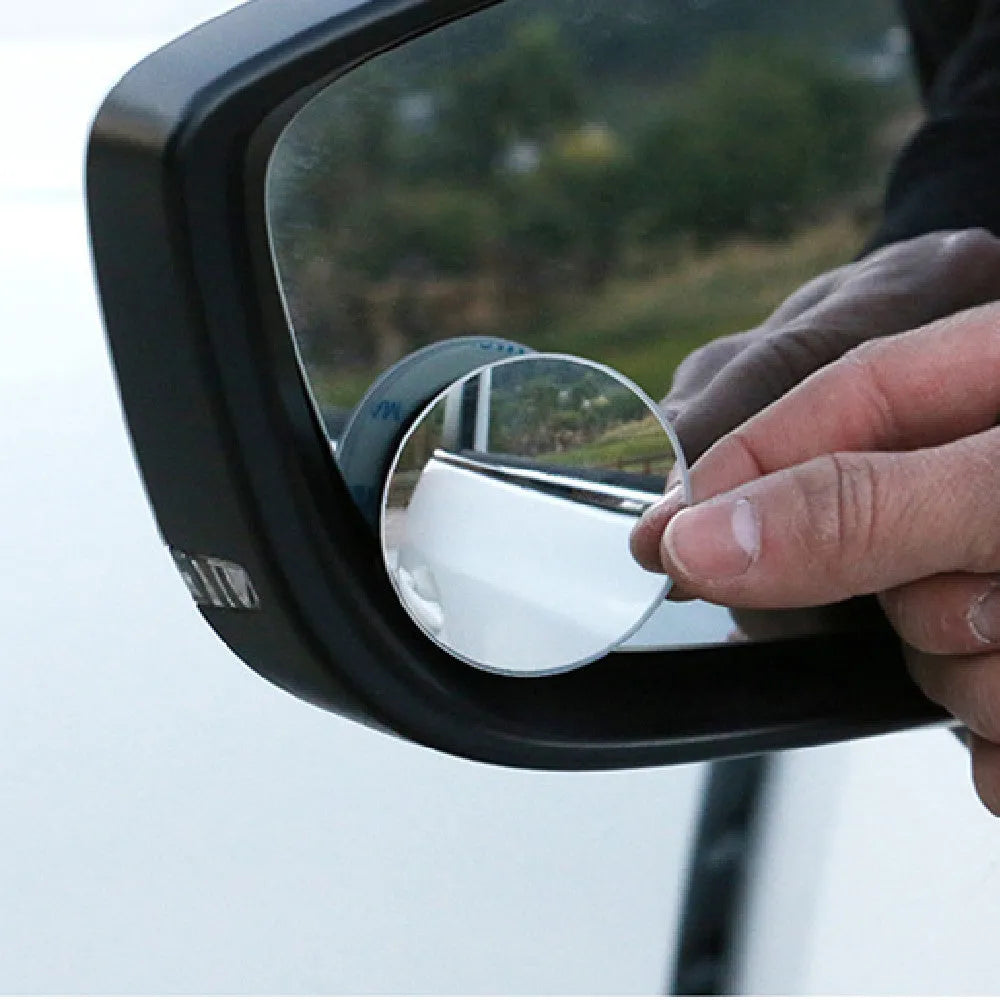 Silver round convex blind spot mirror with adjustable mount for car rearview mirror.