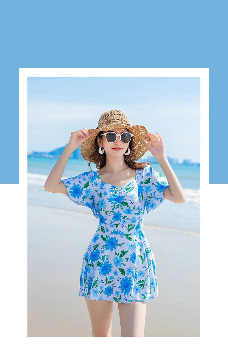 Women's slim-fit one-piece swimsuit with floral print in blue, red, or yellow pattern options.