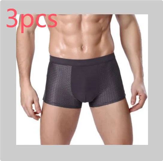 Men's solid colour ice silk modal boxer briefs with U convex design and mid-waist fit.
