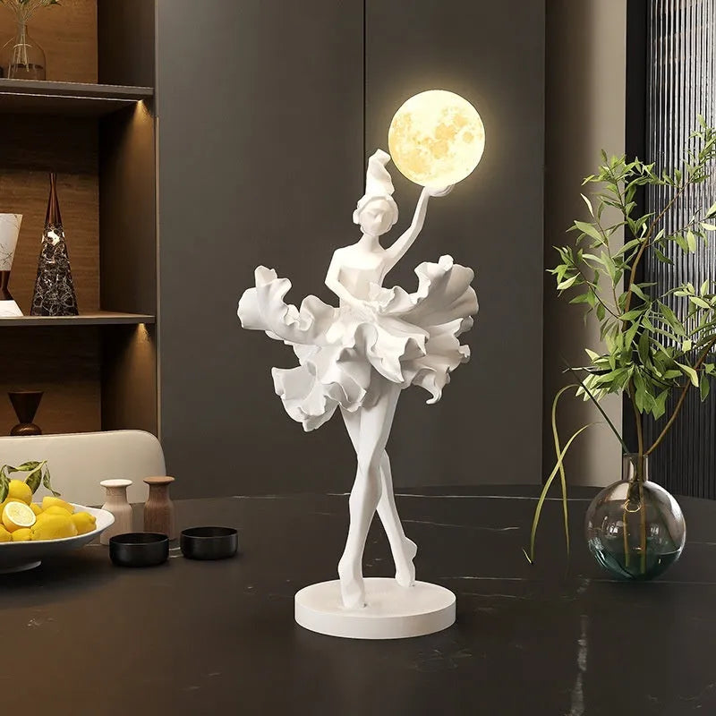 Ballet dancer resin night lamp in pink placed on a hallway table