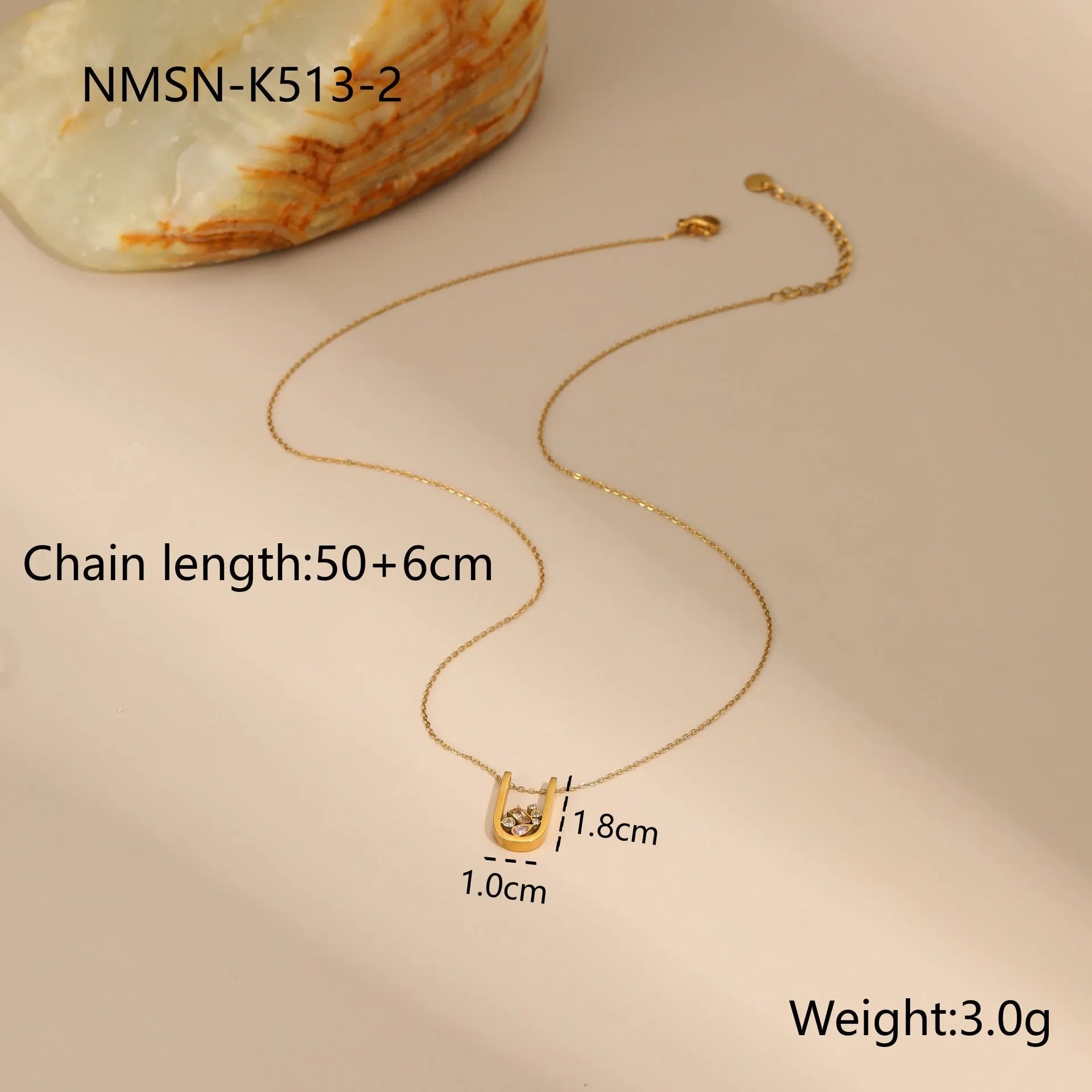 Geometric gold plated jewellery set with necklace, ring, and earrings featuring zircon elements