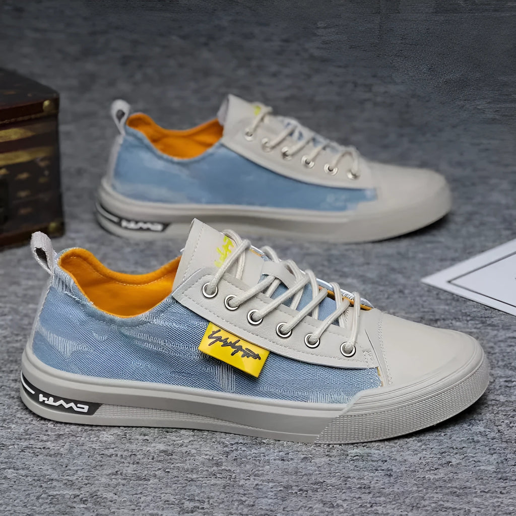 Men's casual canvas shoes in light blue with round toe, rubber sole, and lace-up closure.