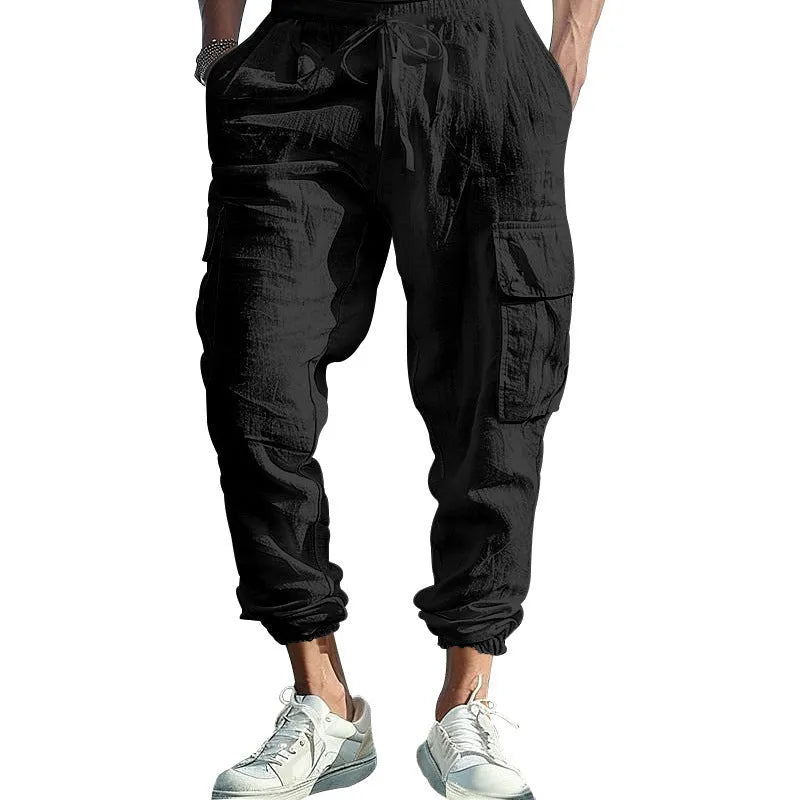 Men's casual linen trousers in solid colour with ankle ties and multiple pockets, loose fit, drawstring waist.