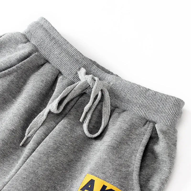 Boys' cotton track pants in black, available in sizes 120cm to 160cm for ages 5-14