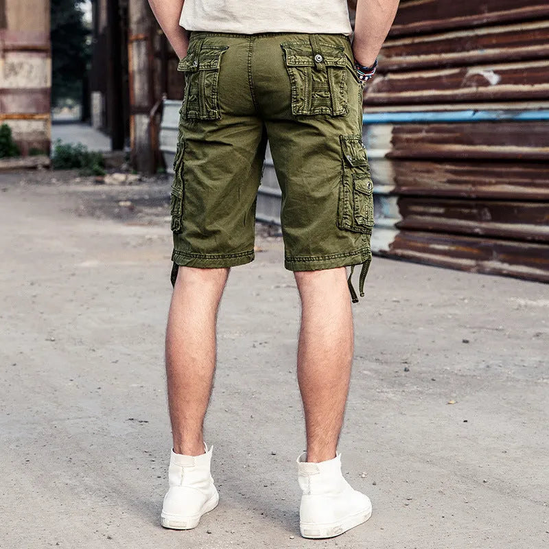 Multi-bag tooling shorts in 100% cotton with multiple pockets, straight leg, and zipper fly in army green
