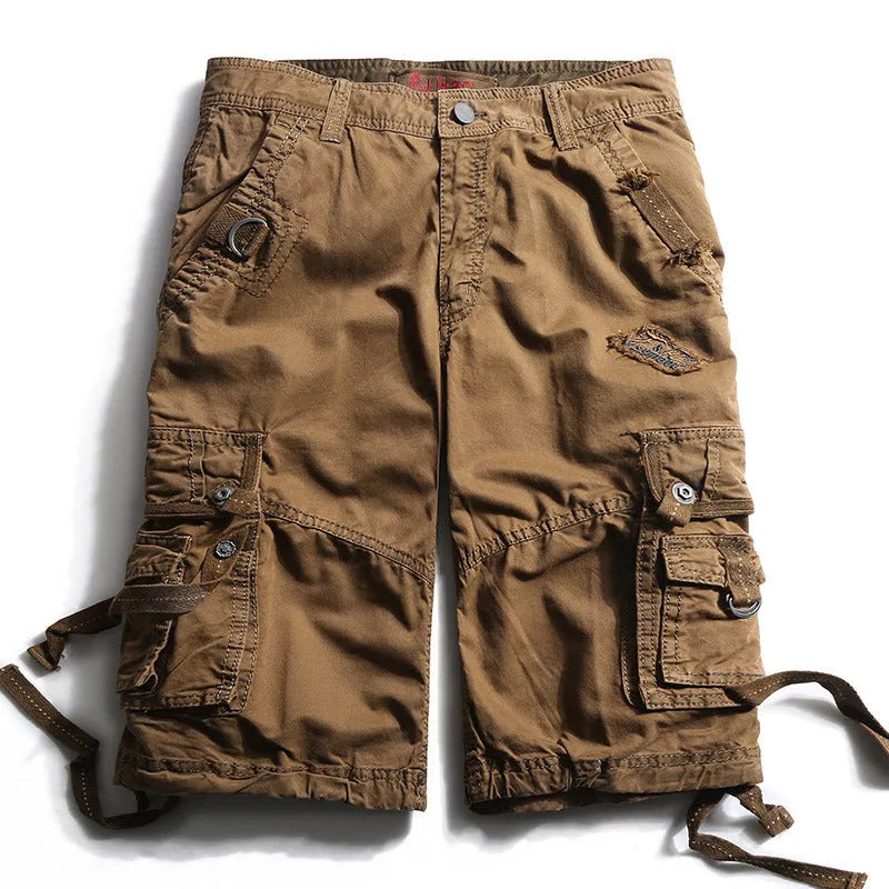 Multi-bag tooling shorts in 100% cotton with multiple pockets, straight leg, and zipper fly in army green