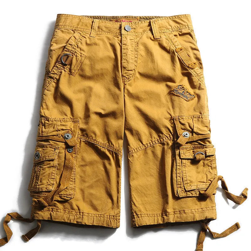 Multi-bag tooling shorts in 100% cotton with multiple pockets, straight leg, and zipper fly in army green