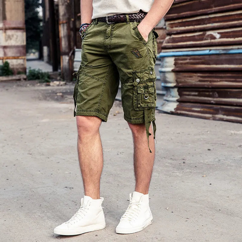 Multi-bag tooling shorts in 100% cotton with multiple pockets, straight leg, and zipper fly in army green