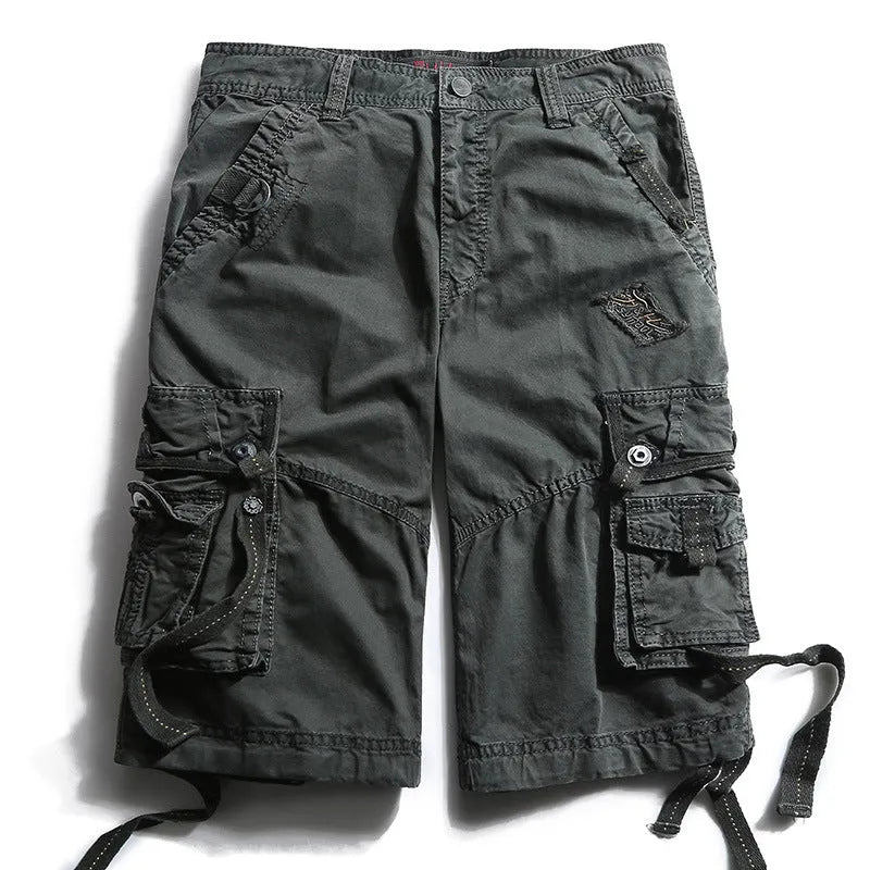 Multi-bag tooling shorts in 100% cotton with multiple pockets, straight leg, and zipper fly in army green