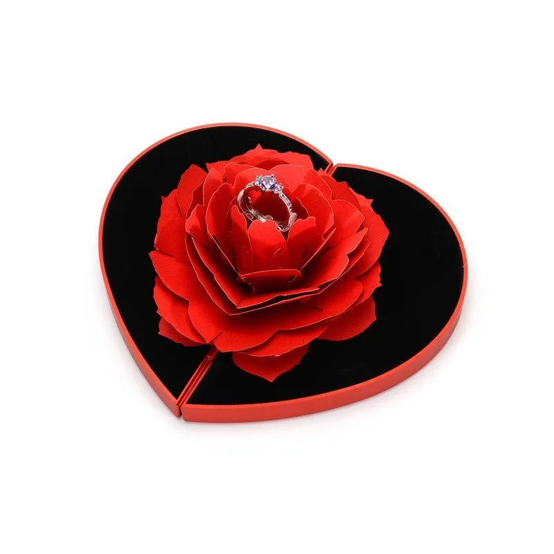 Red heart-shaped rotating ring box with 3D love motif and rose decoration for jewellery packaging