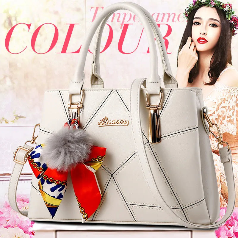Ladies PU messenger bag with embroidery detail and soft handle in cross-section square shape