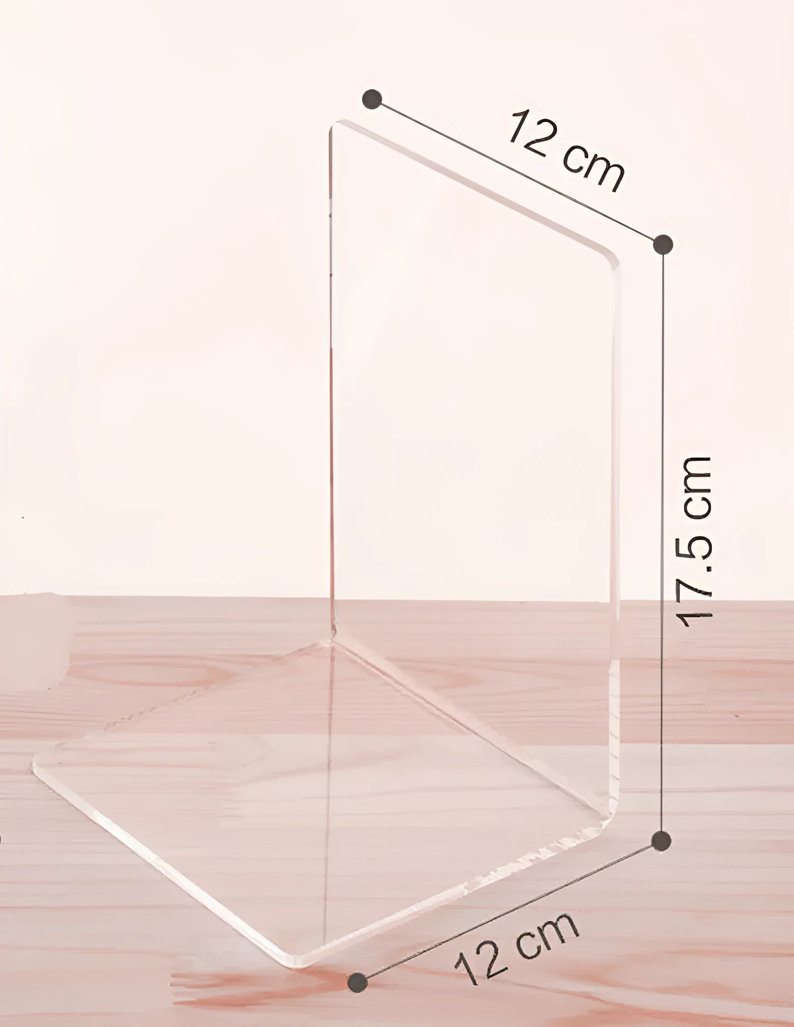 Transparent acrylic bookshelf holding two books on a desk surface