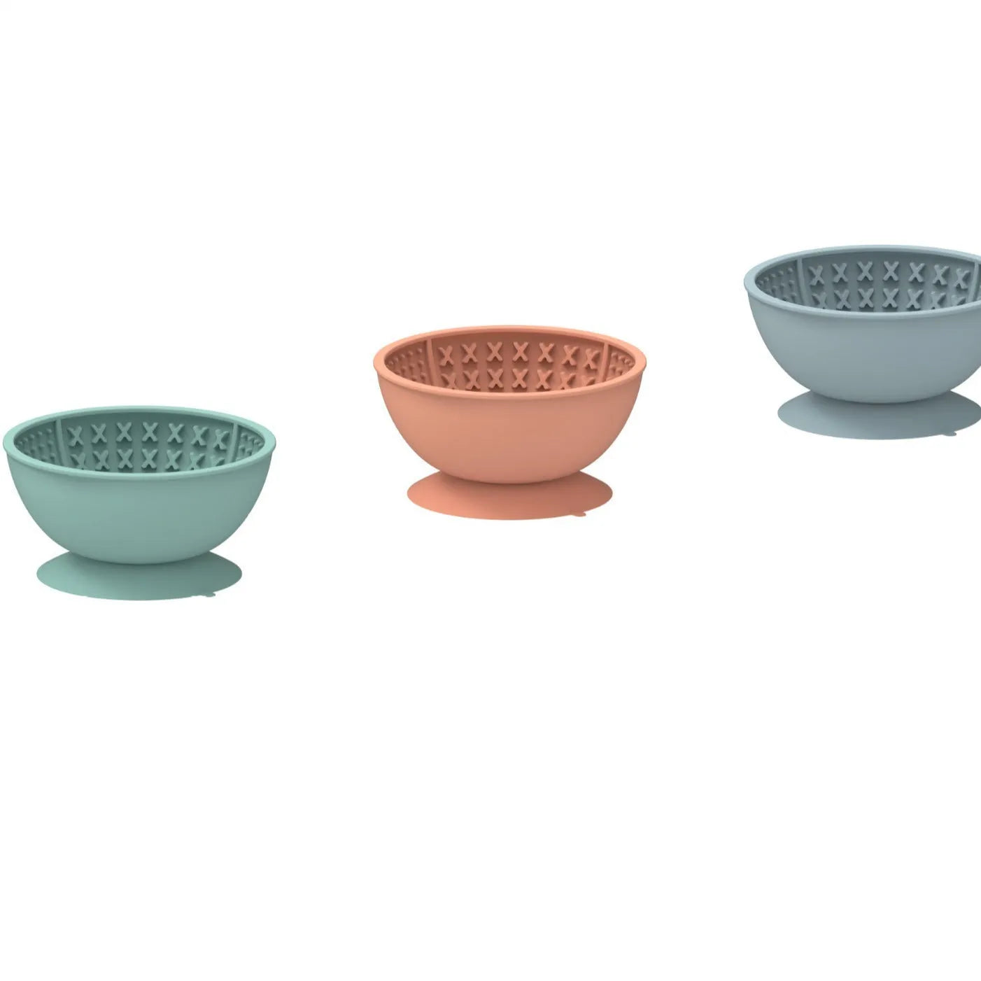 Cyan silicone dog bowl with textured slow feeder patterns and a suction cup base on a table.