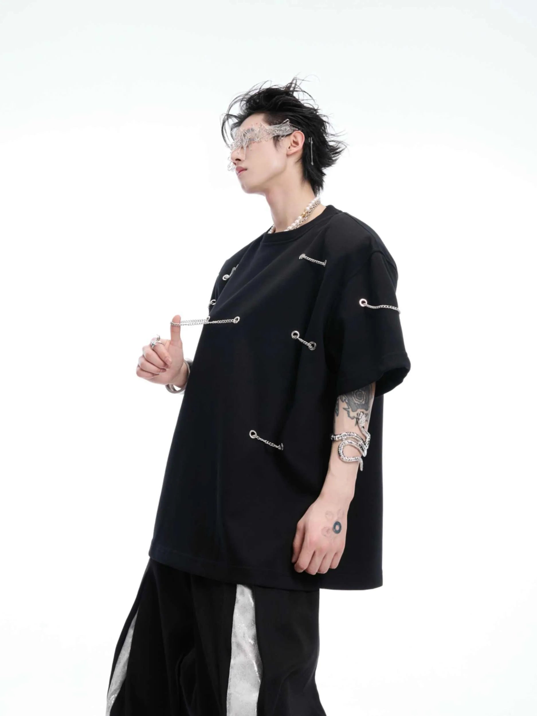 Black heavy cotton t-shirt with metal chain padded shoulder detail, round neck, short sleeves