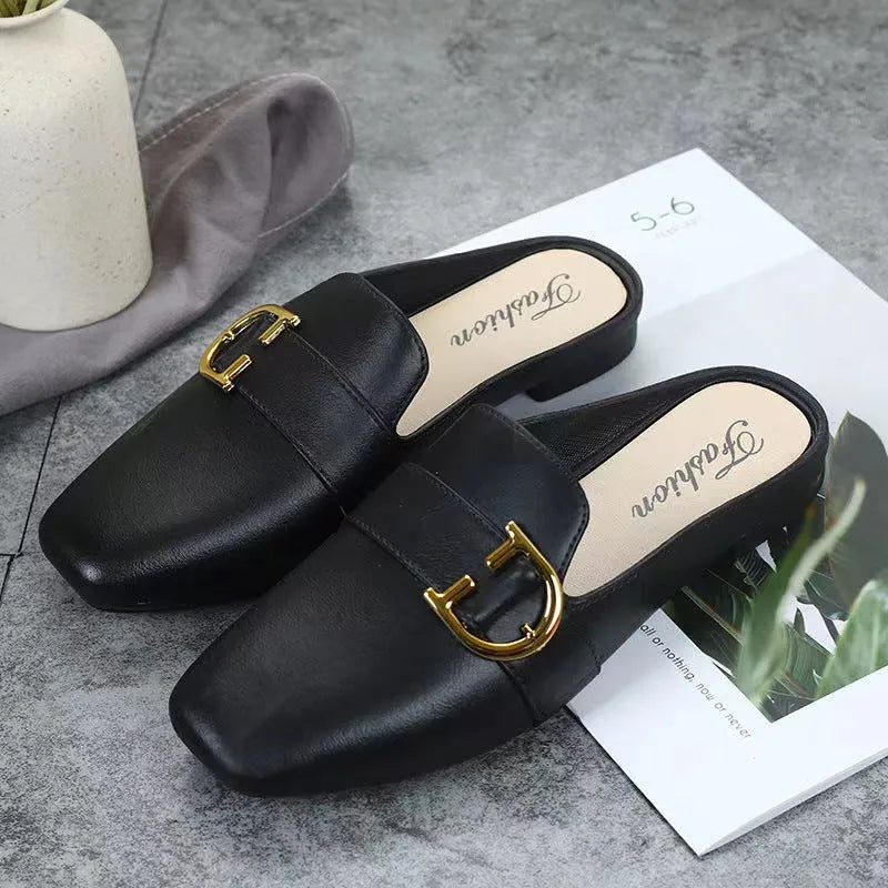 Women's PVC closed toe half slipper with metal buckle fastening in milky white.