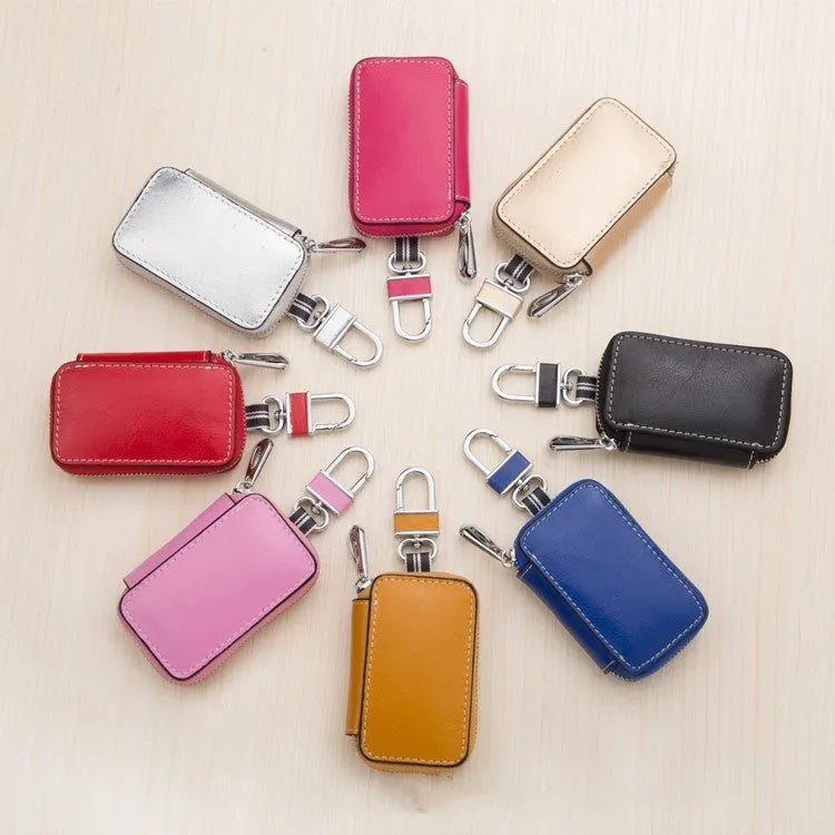 White genuine leather car key case with a plain weave pattern, shown in a square vertical design.