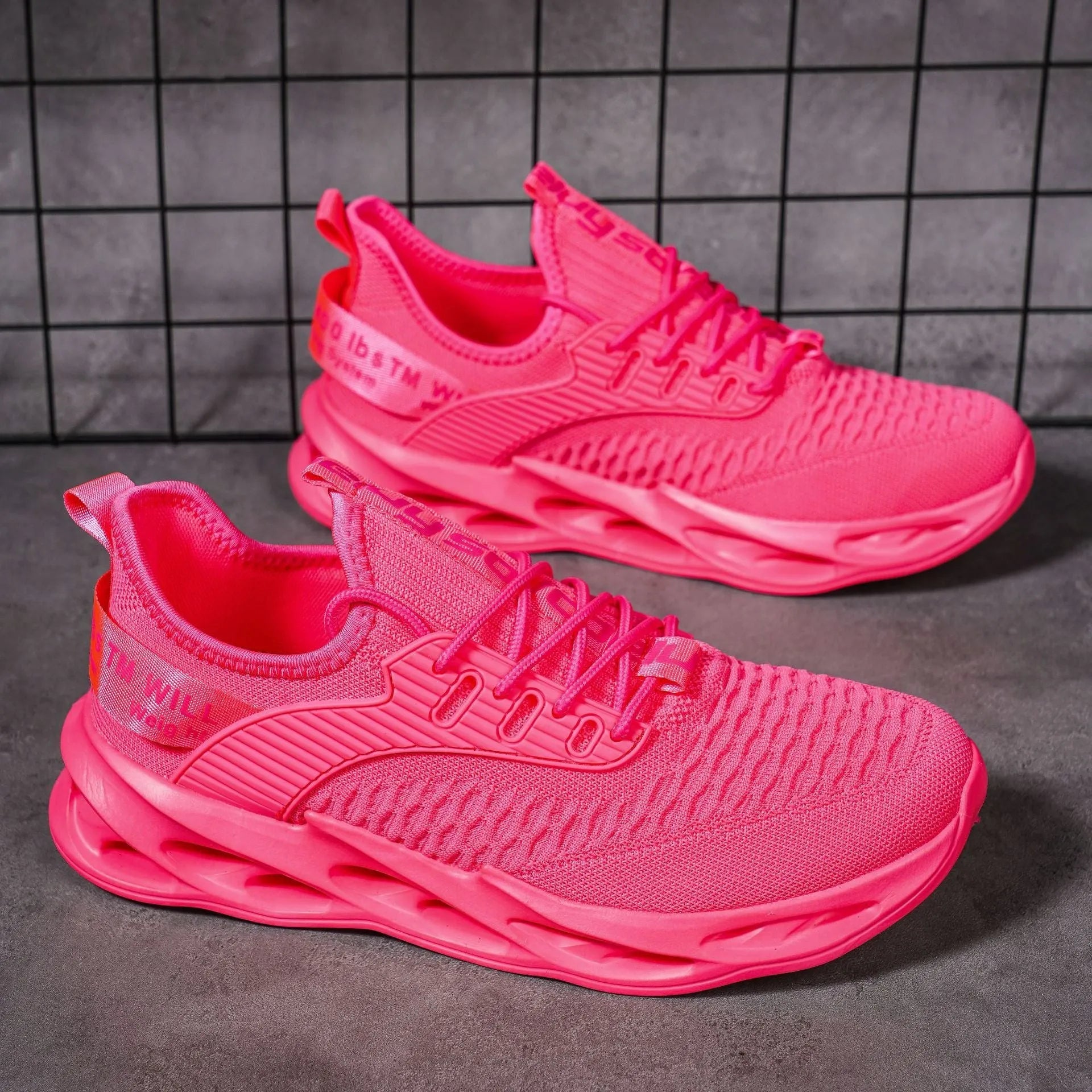 Women's FlyKnit casual shoe in a solid colour with mesh upper and round toe.
