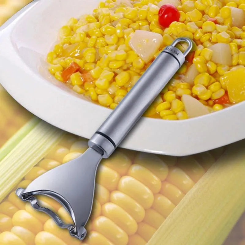 Stainless steel corn planer kitchen tool on a wooden surface