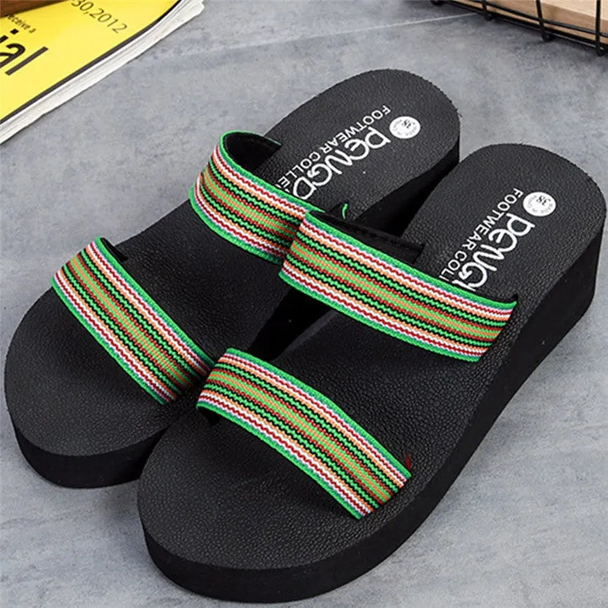Women's brown bohemian slippers with elastic EVA upper and rubber sole on a wooden floor.