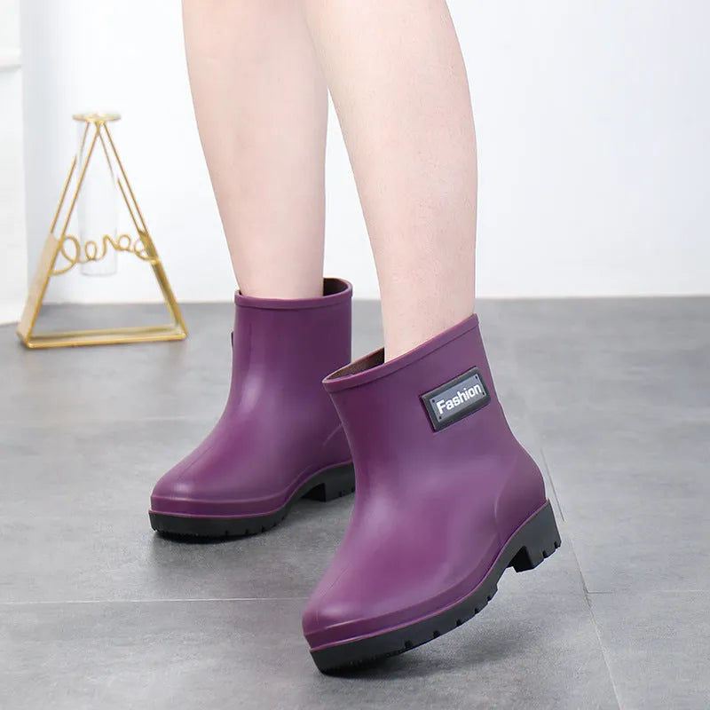 Women's mid-calf PVC rain boots in apricot colour with a low heel for wet weather.