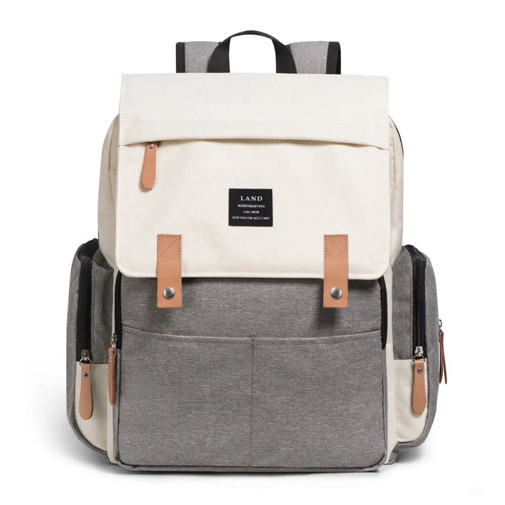 Land Mommy large oxford cloth diaper backpack in grey with a changing mat, shown open.