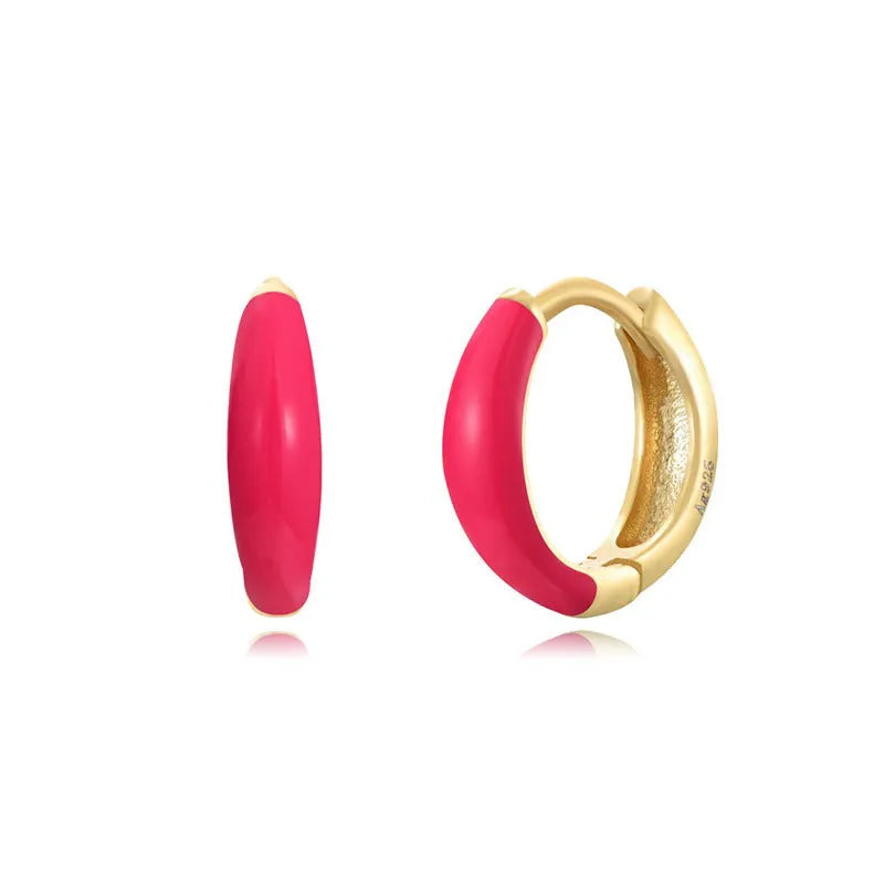 Oval-shaped curved drop earrings with colourful epoxy resin drip finish and silver metal pin.