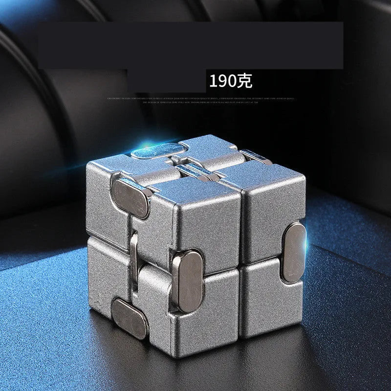 Black zinc alloy infinity cube fidget toy showing eight connected cubes.