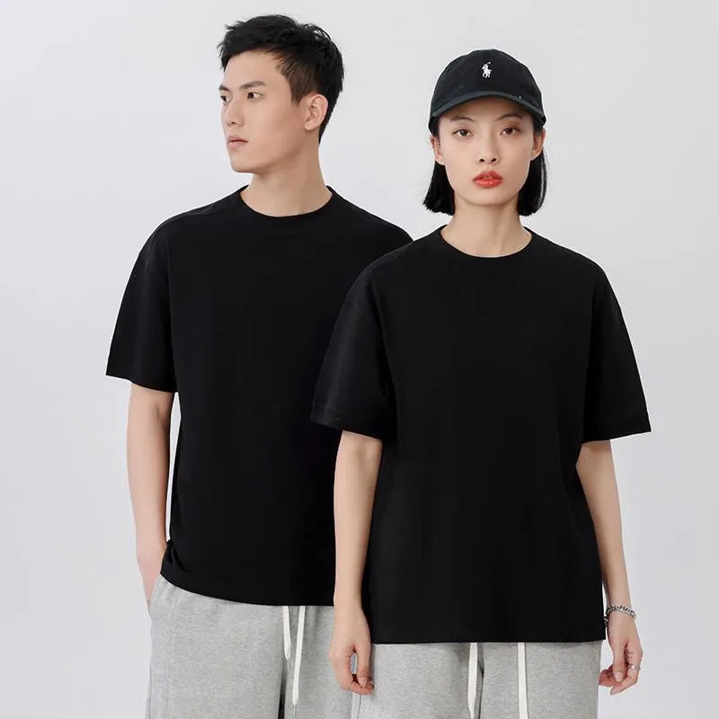 Men's loose grey cotton short-sleeved t-shirt on a hanger, casual summer wear.