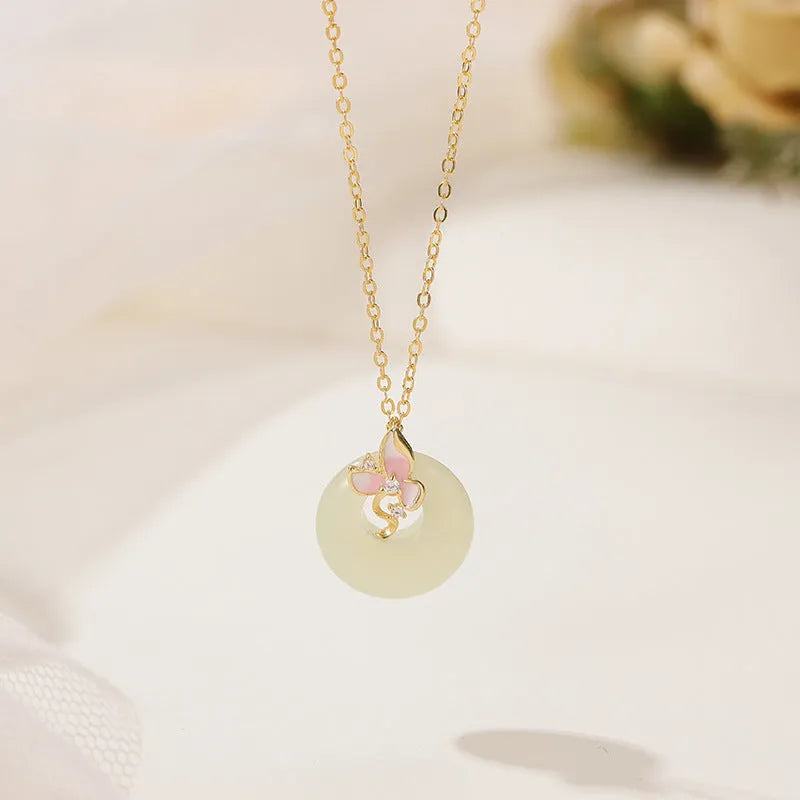Sterling silver orchid necklace on a model, showing the floral pendant and peace buckle clasp.